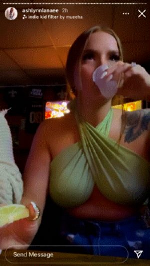 Bar babe with huge tits takes shot