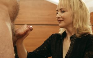 blonde babe giving handjob with facial